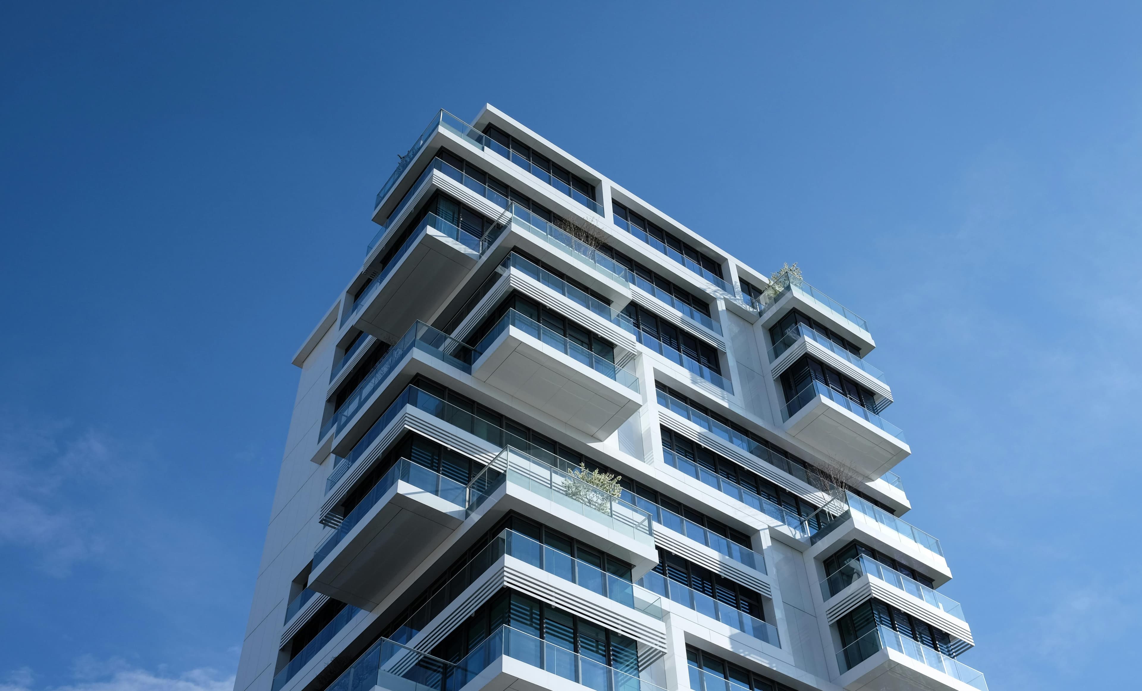 Modern Balconies Under Blue Sky Building